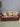 23272 Rustic Tribal Pattern Sleeper Sofa with Red Microfiber Upholstery