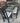 64542 Modern Glass Top Dining Table with Black Frame and Upholstered Chairs