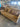10521 Elegant Tan Upholstered Sofa with Paisley Cushions