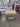 11268 Vintage Wooden Framed Ottoman with Beige Upholstery