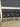 49024 Set of Four Black Metal Bar Stools with Cushioned Backrest