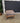 61593 Vintage Upholstered Ottoman with Carved Wooden Legs