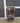 87524 Wooden Media Cabinet with Glass Door and Casters