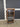 87524 Wooden Media Cabinet with Glass Door and Casters