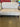 32699 Beige Armless Settee with Dark Legs