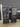 31854 Sleek Black Glass Display Cabinet with Dual Drawers