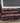 56609 Elegant Burgundy Leather Sofa with Nailhead Trim